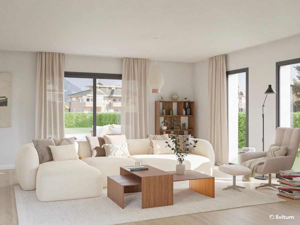 Salón moderno con sofá modular beige, mesitas de centro de madera, butaca y grandes ventanales con cortinas claras.